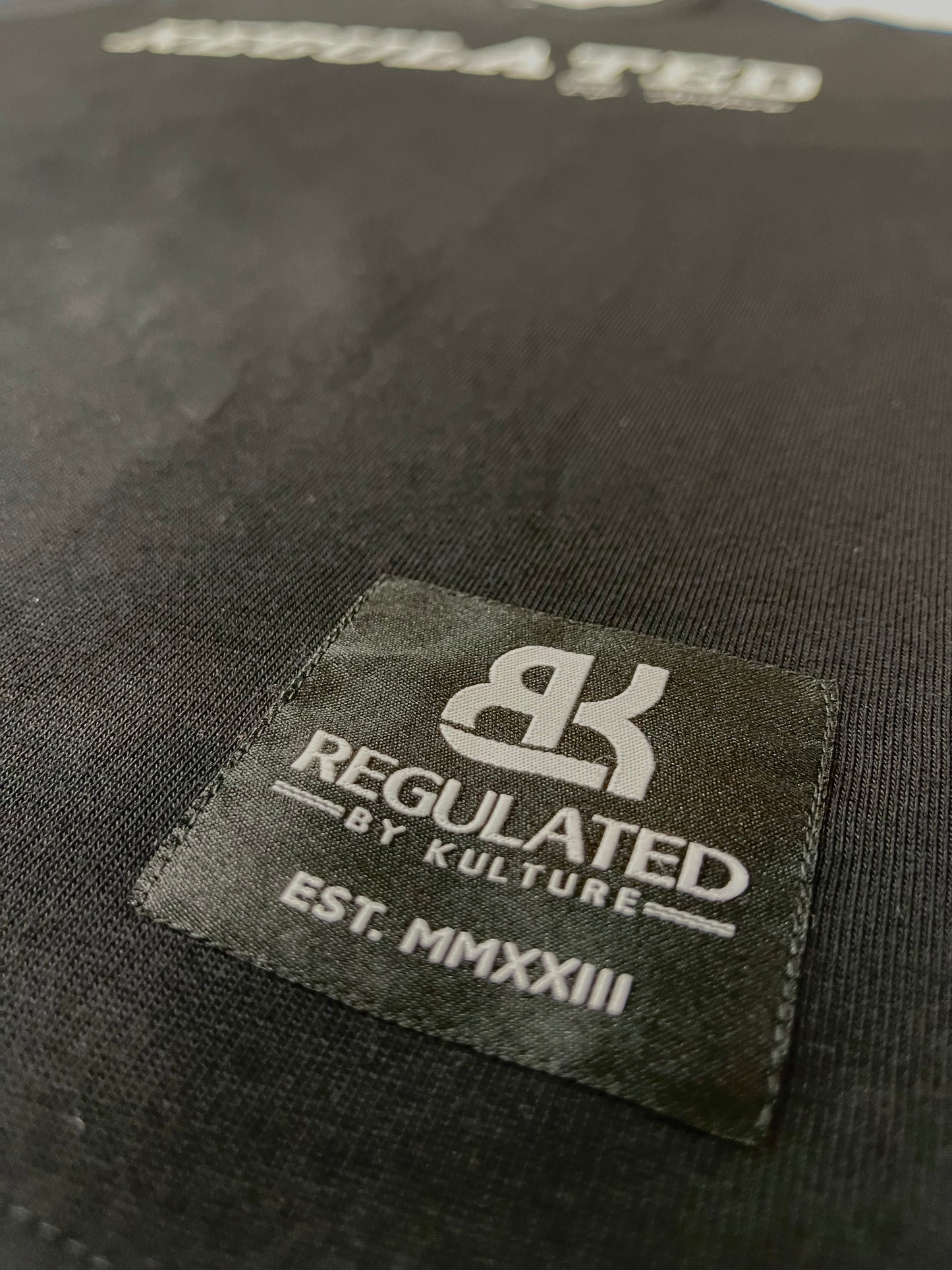 RegulatedByKulture - Black Tee